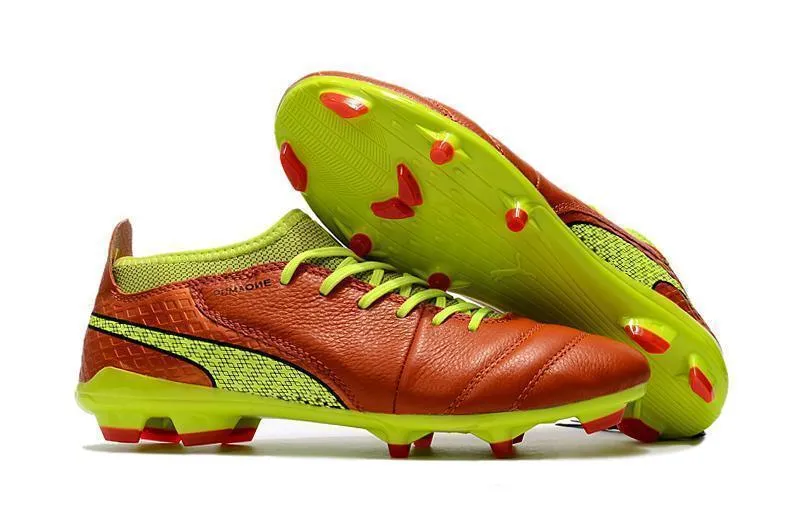 Ball Focus PUMA ONE 17.1 FG Soccer Cleats Orange Volt Black Brown